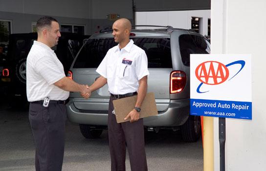 AAA Minneapolis Member shaking hands with a AAA Approved Auto Repair mechanic shop owner